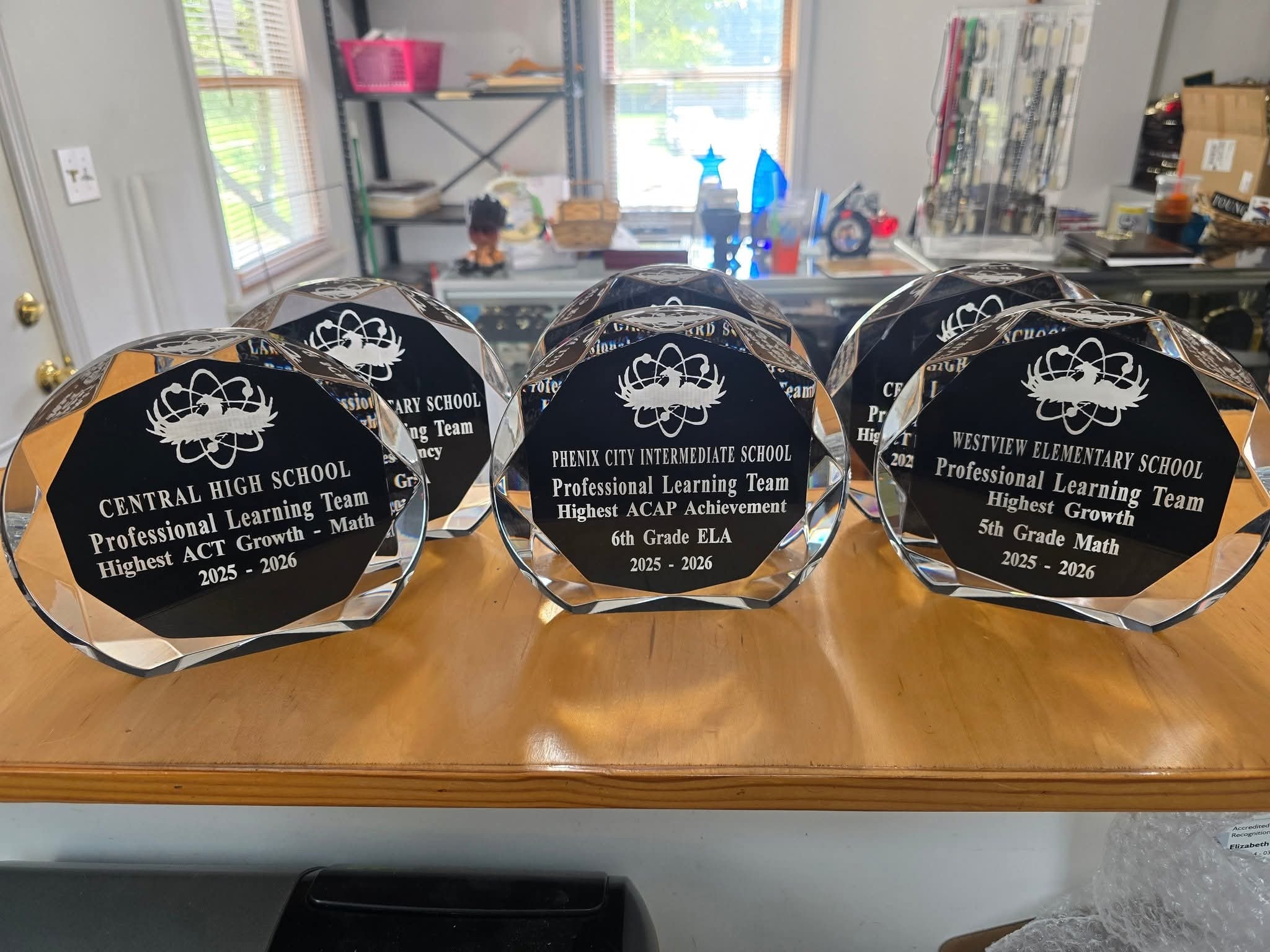 Laser-engraved wood plaques for a school awards banquet